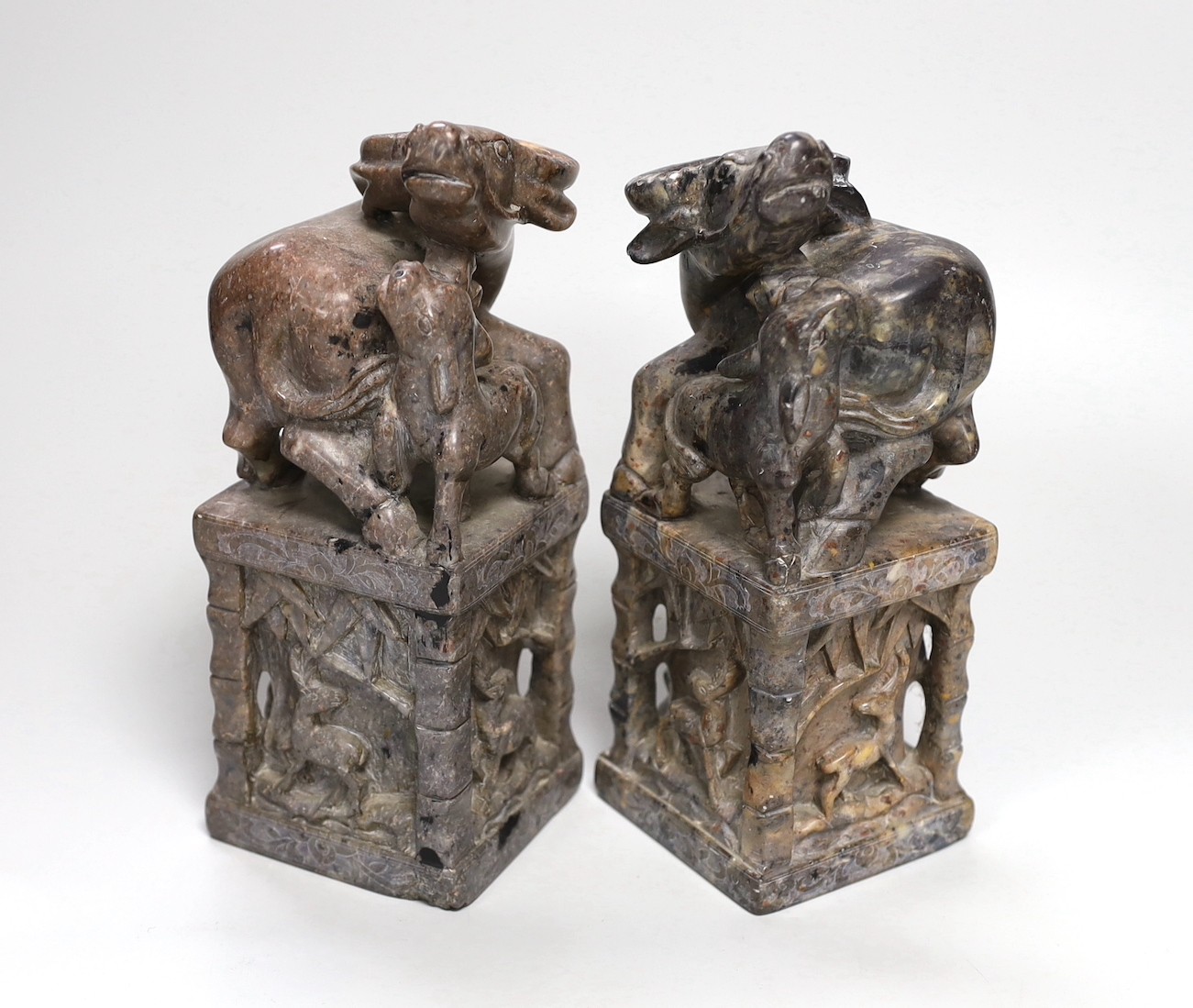 A pair of large Chinese soapstone 'buffalo' seals, 21cm